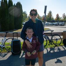 Auguston staff member poses for a photo with a student.
